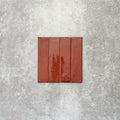 Product image of Puzzle Coral Brick Rectified 5x20cm wall and floor tiles, featuring a glossy coral finish with rich tonal variation and softly aged edges, displayed to highlight the tile's handcrafted character.