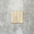 Product image of Puzzle Cream Brick Rectified 5x20cm wall and floor tiles, featuring a glossy cream finish with subtle shade variation and softly aged edges, displayed to highlight the tile's handcrafted character.