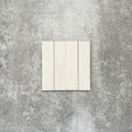 Product image of Puzzle White Brick Rectified 5x20cm wall and floor tiles, featuring a glossy white finish with subtle tonal variation, displayed in a brick format to showcase the tile's handcrafted appearance.