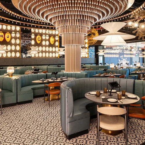 Restaurant interior featuring Abbey Black & White A 28×28cm Victorian-style patterned porcelain mosaic floor tiles.