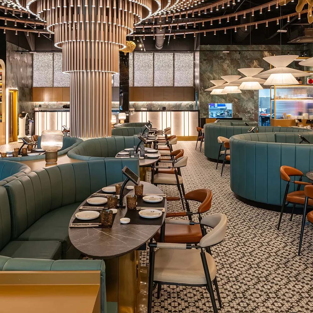 Restaurant interior featuring Abbey Black & White A 28×28cm Victorian-style patterned porcelain mosaic floor tiles.