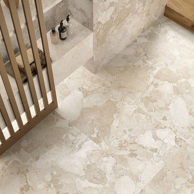 Interior featuring Riad Avorio Sassi Terrazzo Stone 60x120cm stone-effect wall and floor tiles, showcasing warm ivory and beige tones with natural stone-inspired detailing, styled with a walk-in shower, timber accents and contemporary finishes.