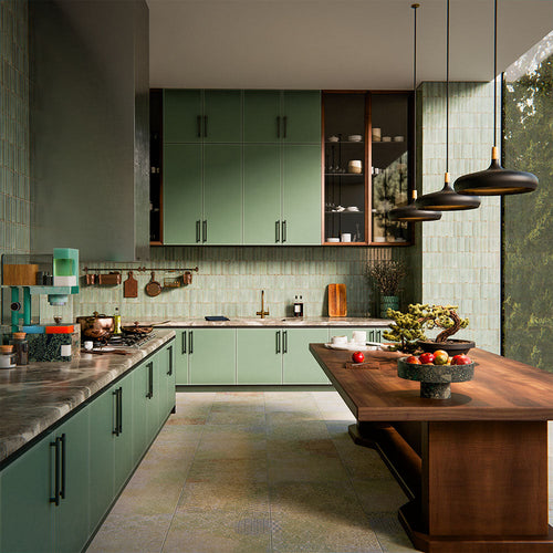 Boho Ocean Blend 60x60cm patterned porcelain floor tiles styled in a contemporary green kitchen setting. The large-format design features a subtle, multi-tonal decorative pattern that blends soft sage, muted blue and warm neutral tones, adding gentle movement underfoot without overpowering the space. Paired with sage cabinetry, warm wood accents and brass details, the patterned floor creates a cohesive, design-led finish ideal for modern kitchen interiors.
