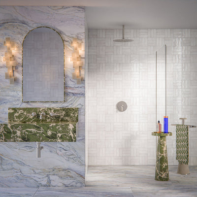 Bathroom interior featuring Foundry Bricks Chalk White 6.5x20cm wall tiles, laid in a structured patterned layout across shower walls, paired with marble effect floor tiles and a green marble vanity for a refined, design-led finish.