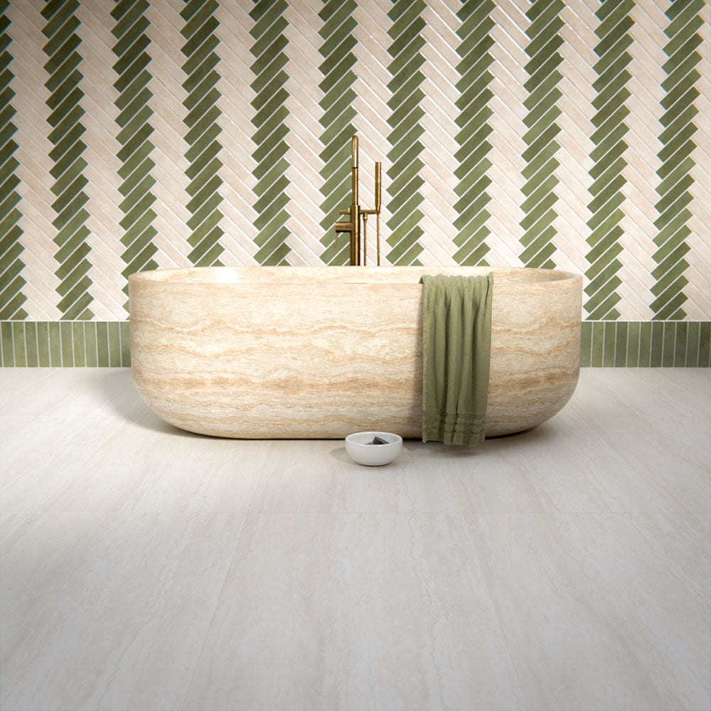 Bathroom interior featuring Trevi Stone 60 x 120cm porcelain floor tiles in a soft matt finish, showcasing a subtle natural stone effect in warm neutral tones, paired with a statement freestanding bath and patterned wall tiles to create a calm, balanced space.