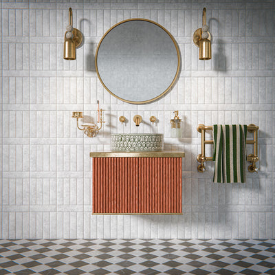 Bathroom featuring Amalfi Square Nero Vintage Marble 11x11cm wall and floor tiles, laid in a diagonal chequerboard pattern, showcasing soft grey and dark tones, paired with brass fittings, a fluted vanity unit, and a classic contemporary finish.