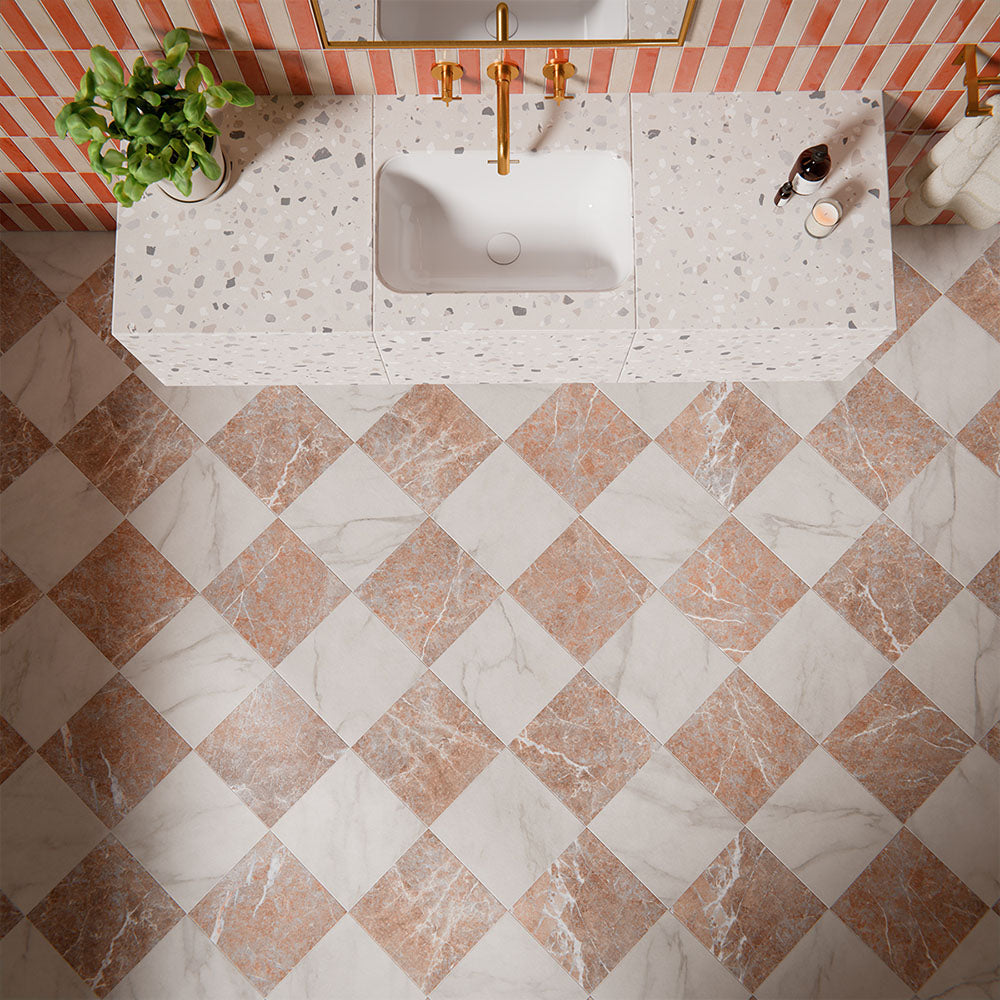 Vitoria Classic Bianco marble style chequerboard tiles in 30x30cm format used on bathroom floors, featuring white and warm marble effect squares laid in a timeless checkerboard pattern for a bold, classic statement interior.