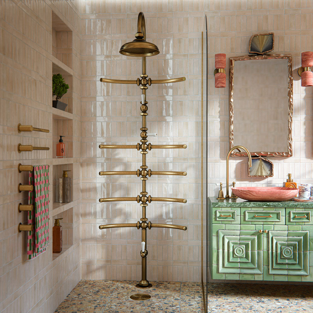 Bathroom featuring Benomar Canvas Moroccan Mini Brick 5x15cm gloss wall tiles, installed in a vertical layout, showcasing soft neutral tones, paired with statement brass fittings, textured vanity details, and a warm, design-led interior setting.