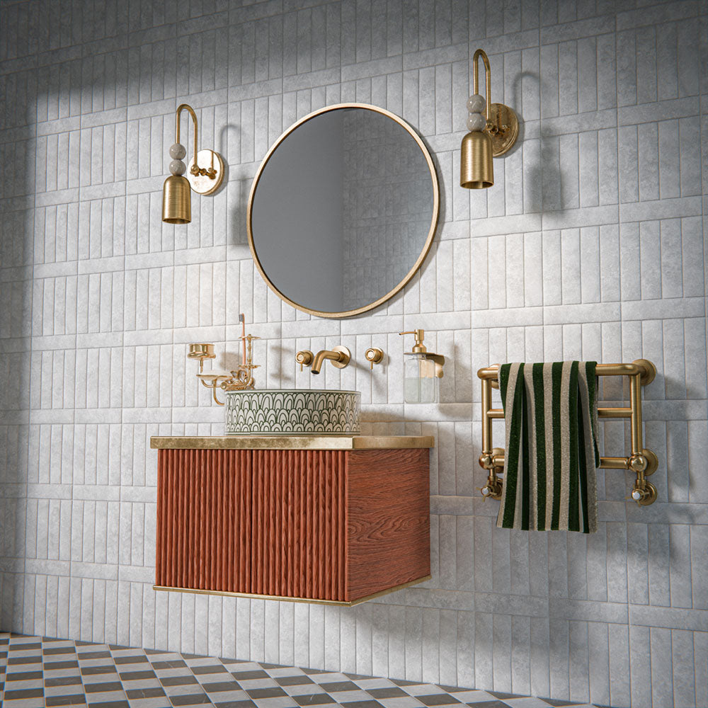 Bathroom featuring Amalfi Brick Carrara Vintage Marble 5.4x22cm wall and floor tiles, installed in a brick layout, showcasing soft white and grey tones, paired with brass fittings, textured details, and a refined, classic contemporary finish.