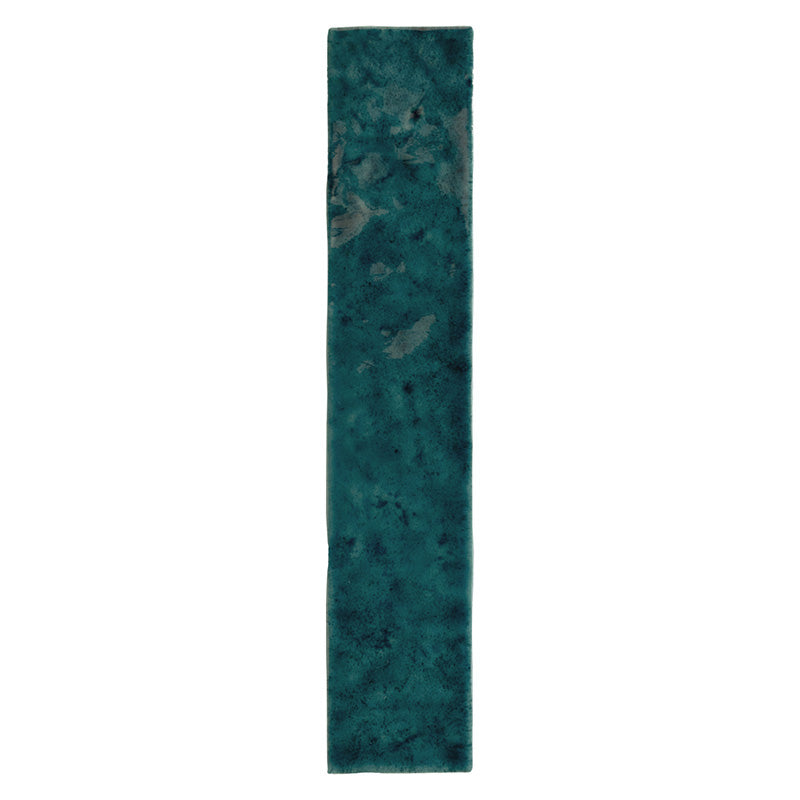 Bora Bora Amun Blue Brick ceramic wall tile in a 6.5 × 32.8cm slim brick format, featuring deep blue-green tones with natural flux glaze variation and subtle surface texture, shown as a single tile on a white background.