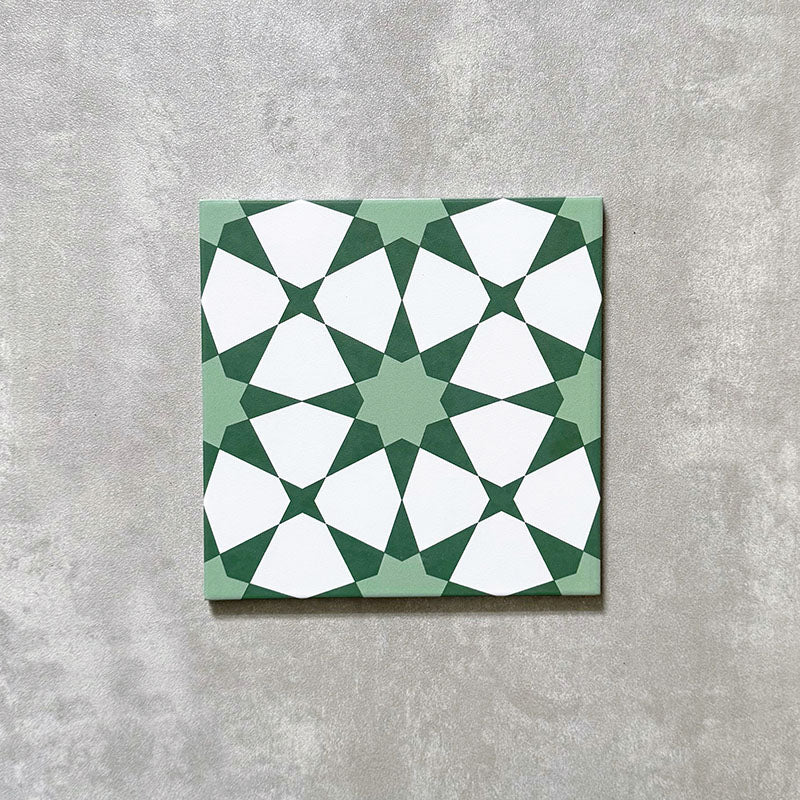 Agadir Green Moroccan-style 20x20cm porcelain tile featuring a geometric star pattern in soft green and white, shown as a single tile on a neutral background.