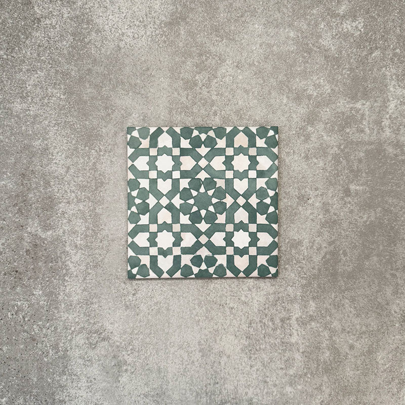 Berber Tetuan Green 15×15cm Moroccan-style porcelain tile featuring a green and cream geometric pattern on a neutral background.