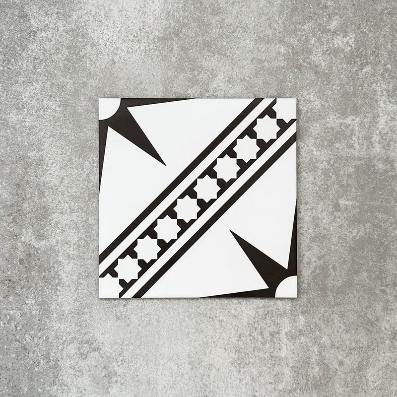 Gilgamesh Blanco Vintage White Moroccan style 20x20cm patterned tile, shown as a single tile highlighting the white and black geometric star design.