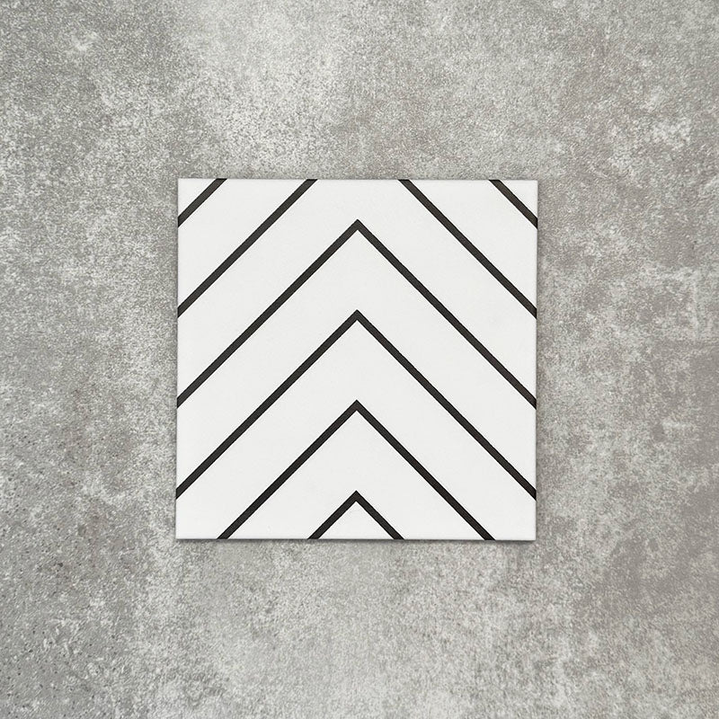 Single Almeria Jilani White Moroccan-style porcelain tile featuring a clean black line chevron pattern on a white base, 20x20cm, suitable for wall and floor use.