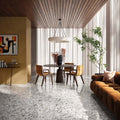 Contemporary living and dining space featuring Stuzzi Lunar 60x120cm terrazzo style porcelain floor tiles with a soft light grey base and a blend of white, silver, charcoal and taupe stone fragments. The realistic 4D brushed finish adds depth and texture, complementing the warm wood ceiling, neutral furnishings and modern interior.