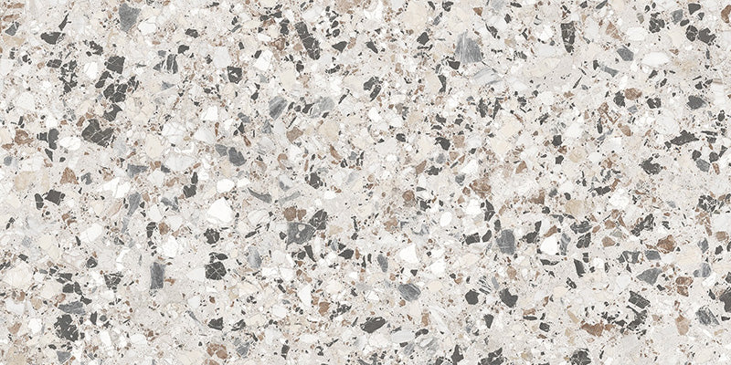 Close-up of the Stuzzi Lunar 60x120cm terrazzo style porcelain tile, featuring a soft light grey base with a blend of white, silver, charcoal and taupe stone fragments. The realistic 4D brushed finish enhances the texture and depth, creating an authentic terrazzo effect.