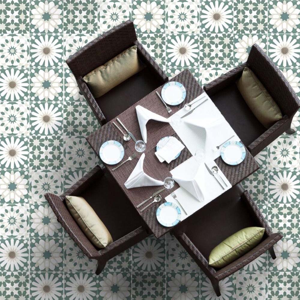 Dining area floor featuring Souk Green B 20×20cm Moroccan-style porcelain tiles arranged in a green and white geometric pattern.