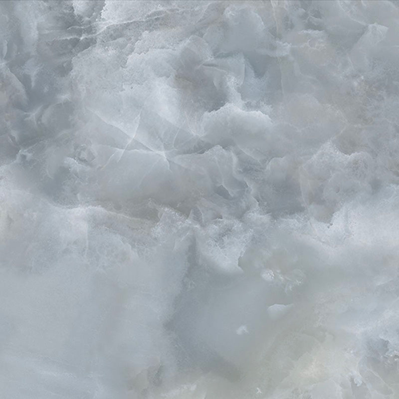 Close-up of Thebes Blue Honed Matt Onyx 60x60cm porcelain tile featuring soft blue onyx-effect veining with layered white, grey and pale blue tones. The honed matt finish creates a luxurious natural stone look, perfect for bathroom walls, feature walls and elegant interiors.