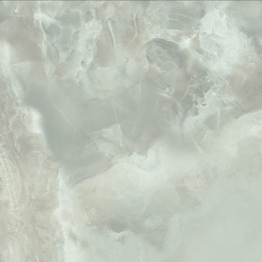 Close-up of Thebes Green Honed Matt Onyx 60x60cm porcelain tile featuring soft green onyx-effect veining with cloudy white and pale sage tones. The honed matt finish creates a natural stone look, ideal for bathroom walls, feature walls and luxurious interior spaces.