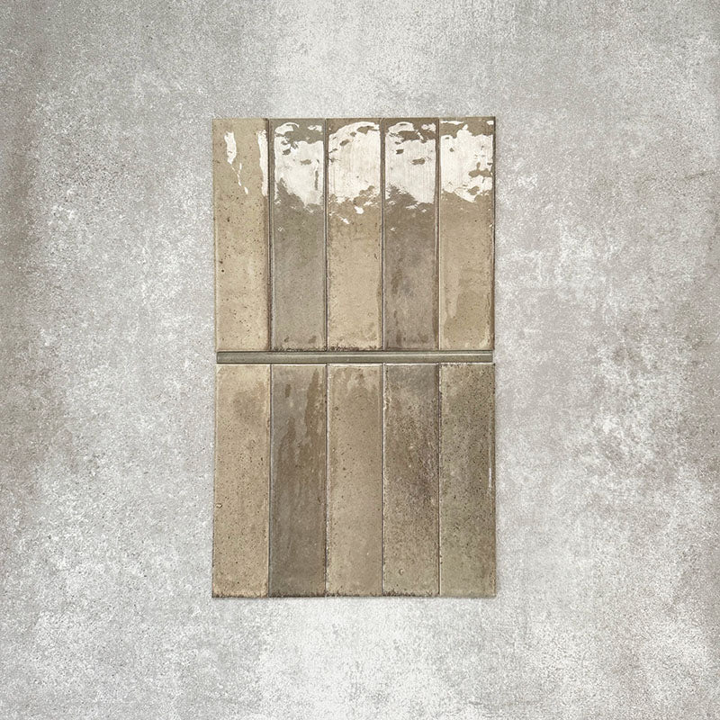 Allegra Sage Green Gloss pencil bullnose border ceramic tiles in a 1.2 × 30cm format, shown laid vertically to highlight the muted green tones, glossy finish and subtle handmade-style variation, ideal for edging and decorative borders.