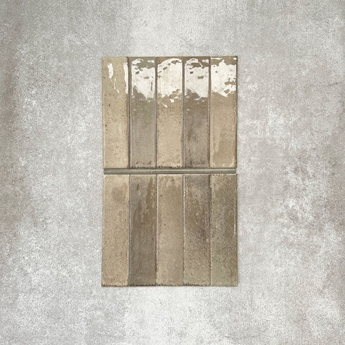 Allegra Sage Green Gloss pencil bullnose border ceramic tiles in a 1.2 × 30cm format, shown laid vertically to highlight the muted green tones, glossy finish and subtle handmade-style variation, ideal for edging and decorative borders.