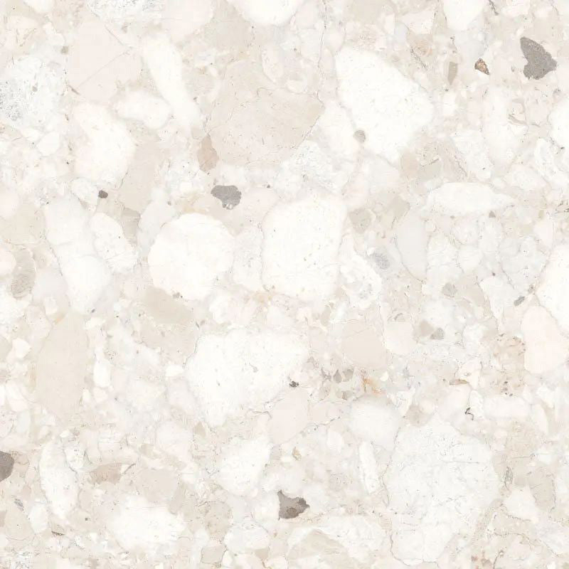 Close-up of Venice Ivory matt terrazzo effect porcelain tile in a 60 x 60cm format, featuring soft ivory tones with natural stone fragments for a timeless, elegant wall or floor finish.