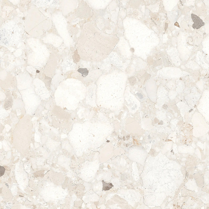 Close-up of Venice Ivory polished terrazzo effect porcelain tile, featuring soft ivory and cream tones with natural stone chips and a polished finish, ideal for luxurious kitchen, bathroom and living room walls and floors.