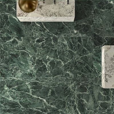 Bathroom interior featuring Verde Apia Polished Green Marble effect 60 × 60cm porcelain wall and floor tiles, styled with a floating vanity, brass basin, and rich green tones with intricate natural veining.
