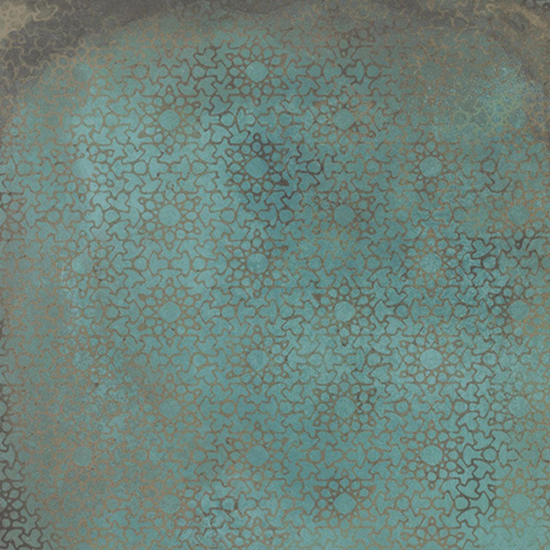 Close-up of Verde Patterns Copper Oxide 60cm x 60cm metallic effect porcelain tile, featuring an etched Art Deco-inspired fan pattern in rich blue-green tones for contemporary statement wall and floor designs.