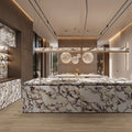 Kitchen interior featuring Viola Polished Marble effect 60 × 120cm porcelain wall and floor tiles, styled across a large island and feature surfaces, highlighting bold burgundy veining and a high-gloss finish.