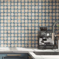 Kitchen featuring Zanzibar Moroccan Arena Blue wall tiles as a striking splashback, showcasing a blue and cream Moroccan style geometric pattern, paired with navy cabinetry, white worktops, brushed brass handles and contemporary stainless steel fixtures.