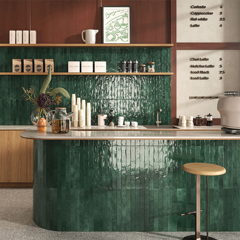 Pine Forest Green 5x40cm gloss tiles used on a café counter, creating a bold, handcrafted green feature wall